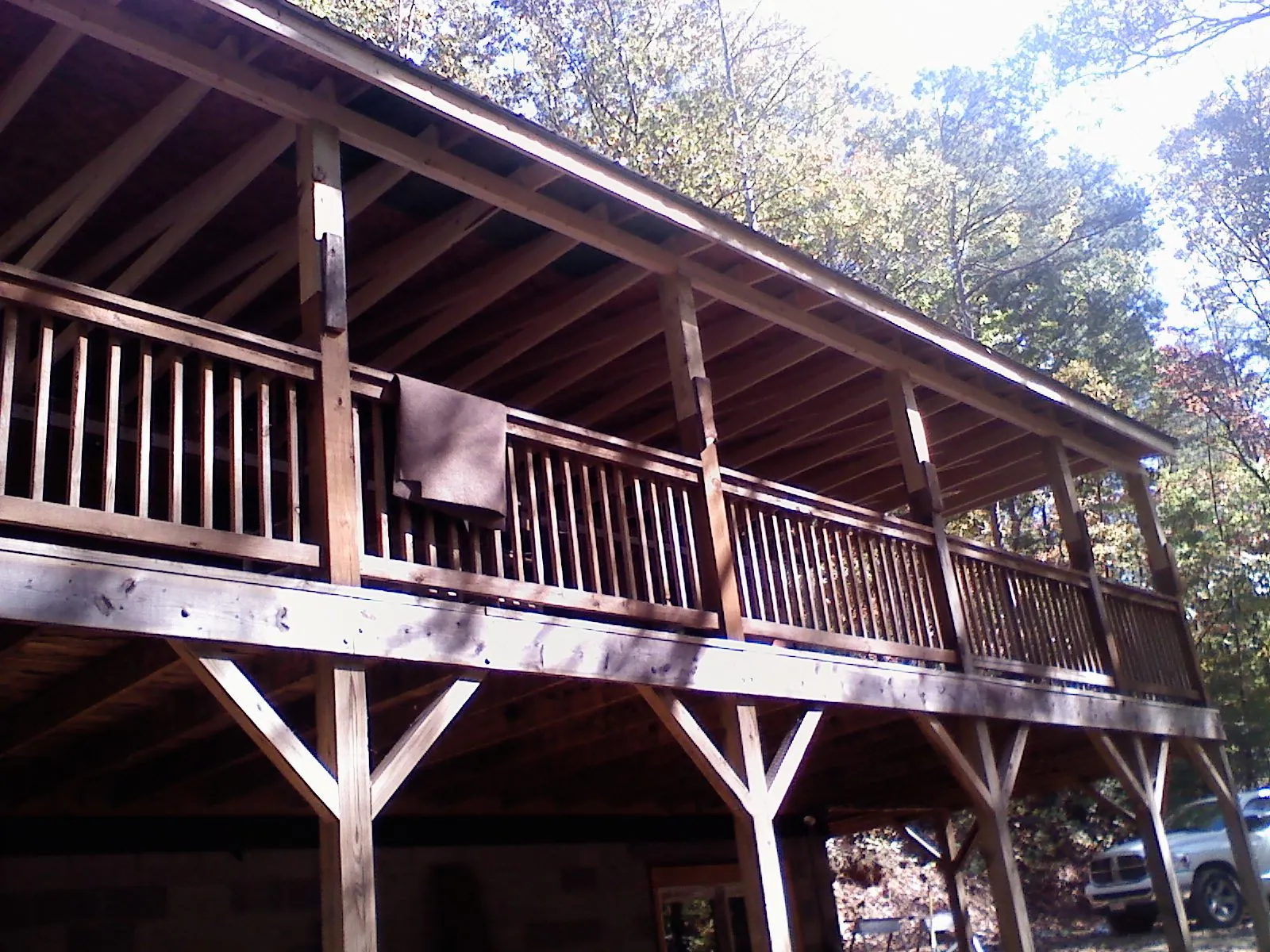 Timber framing under a new elevated porch and deck — Roof Leak Repair in Childwold by Roofing Brothers